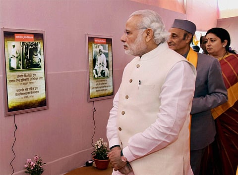 Prime Minister Narendra Modi visiting an exhibition on the occasion of the Centenary Year Convocation of the Banaras Hindu University BHU in Varanasi on Monday. Union Minister for Human Resource Development Smriti Irani and Congress leader Karan Singh are