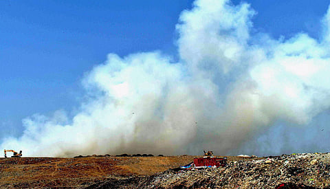Smoke rises after a fire broke out at Deonar dumping ground in Mumbai on Monday. | PTI