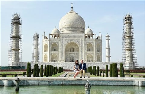 Britain's Prince William, along with his wife, Kate, the Duchess of Cambridge, pose in front of the Taj Mahal in Agra, India. |AP