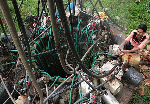 A well near Thodupuzha where 35 motor pumps have been put to use to quench the thirst of the neighbourhood of about 250 people. | ALBIN MATHEW