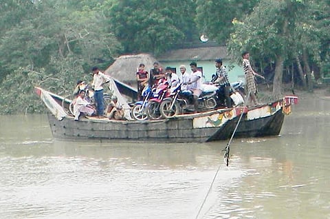 In absence of bridge, people forced to use rickety boats