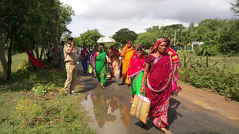 Refusing to accept compensation irate people returning home from a temporary shelter in Balasore district. | EPS