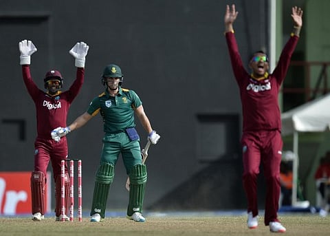 Sunil Narine celebrates dismissing South Africa's Farhaan Behardien by a leg before wicket (LBW) during the first One-day International (ODI) cricket match between the West Indies and South Africa in the Tri-Nation Series in Georgetown, Guyana on June 3,