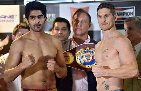 Boxer Vijender Singh and Australia's Kerry Hope face off at the weigh-in ceremony on the eve of their fight for the WBO Asia Pacific Super Middleweight Championship. | PTI