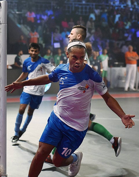Former Brazilian footballer and Goa5s's team captain Ronaldhino celebrates after a goal against Bengaluru5s Green at the Premier Futsal Football League at Nehru Indoor Stadium in Chennai on Sunday. | PTI