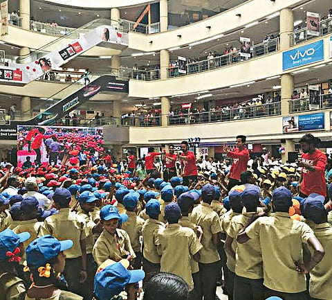 School uniforms for free with a flash dance mob at a mall