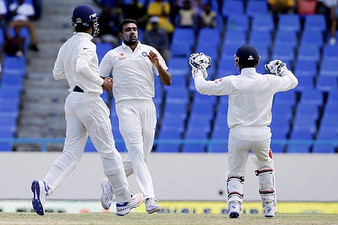 India's bowler Ravichandran Ashwin center celebrates with teammates after he bowled out West Indies' Marlon Samuels during day four of their first cricket Test match at the Sir Vivian Richards Stadium in North Sound Antigua Sunday July 24 2016. | AP