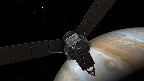 This illustration depicts NASA's Juno spacecraft at Jupiter, with its solar arrays and main antenna pointed toward the distant sun and Earth.| NASA