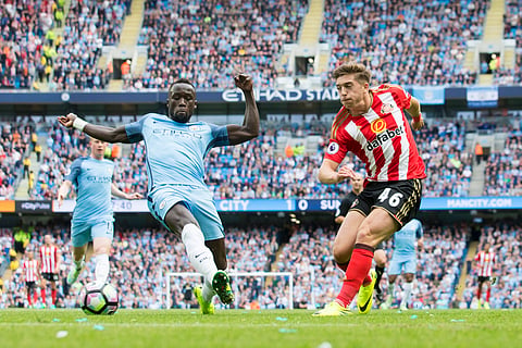 Manchester City's Bacary Sagna, left, attempts to block a cross by Sunderland's Lynden Gooch during the English Premier League soccer match between Manchester City and Sunderland at the Etihad Stadium in Manchester, England, Saturday Aug. 13, 2016. | AP