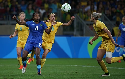 Brazil's Formiga, left, and Australia's Chloe Logarzo fight for the ball during extra time of quarter-final match of the women's Olympic football tournament between Brazil and Australia at the Mineirao Stadium in Belo Horizonte, Brazil, Saturday Aug. 1