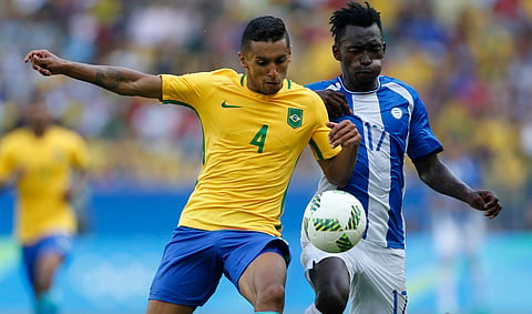 Brazil's Marquinhos, left, and Honduras' Alberth Elis vie for the ball during a semi-final match of the men's Olympic football tournament between Brazil and Honduras at the Maracana stadium in Rio de Janeiro, Brazil, Wednesday Aug. 17, 2016. | AP