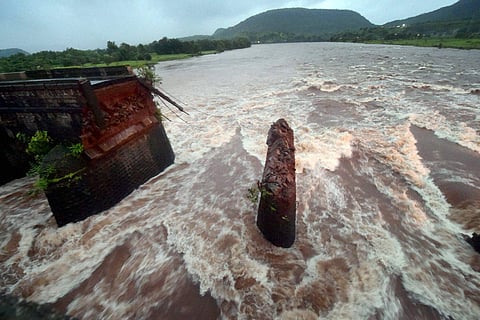 Remaining portion of Mahad-Poladpur bridge in Raigad district on Thursday which was washed away in flood water of Savitri river on the Mumbai-Goa highway on Wednesday. | PTI