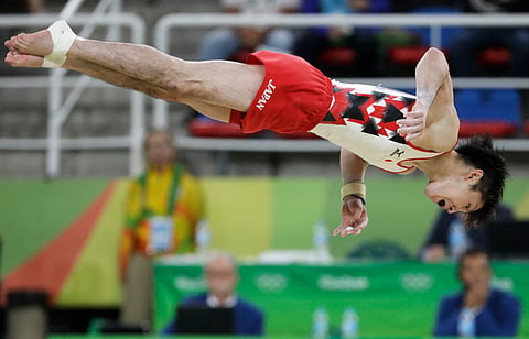 Japan's Kohei Uchimura performs on the floor during the artistic gymnastics men's qualification at the 2016 Summer Olympics in Rio de Janeiro, Brazil, Saturday, Aug. 6, 2016. | AP