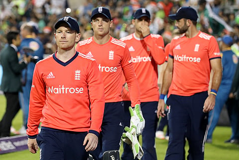 England's Eoin Morgan leads his players off the pitch after losing against Pakistan, after the Twenty20 match between England and Pakistan, at Old Trafford, in Manchester, England, Wednesday Sept. 7, 2016. | AP