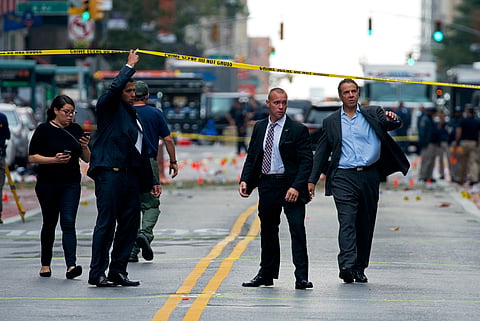 New York Gov. Andrew Cuomo, right, walks from the scene of an explosion in Manhattan's Chelsea neighborhood, in New York, Sunday, Sept. 18, 2016, after an incident that injured passers-by Saturday night. | AP
