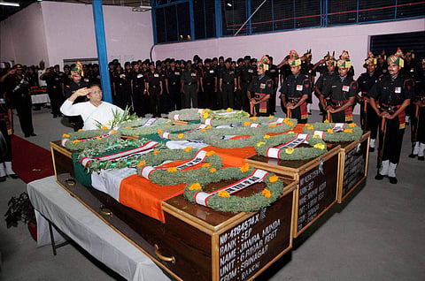 Jharkhand Governor Droupadi Murmu offering tribute to slain Army jawans Jawra Munda Nayan Kumar and S K Vidyarthi in Ranchi on Monday. Army jawans died in a terror attack at Uri near Line of Control on Sunday mornning | PTI