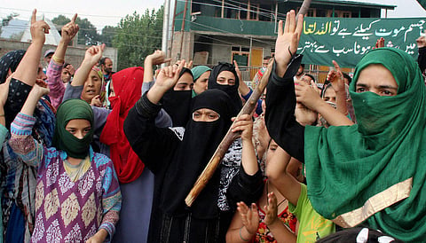 Women shout slogans during a protest against the killing of civilians in Srinagar on Tuesday. (PTI)