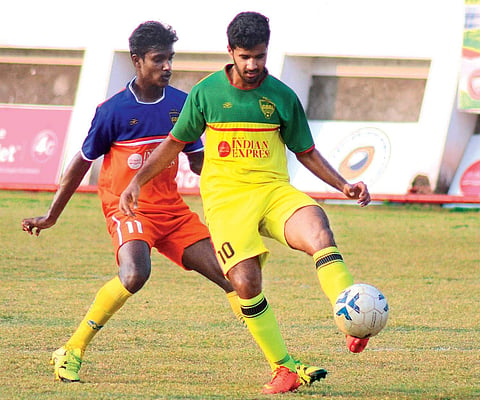 Nirmala College’s Ajith Shivan (left) and Baselius College’s Nidheesh in action during TNIE GOAL 2016 at Malappuram District Sports Council Stadium on Tuesday