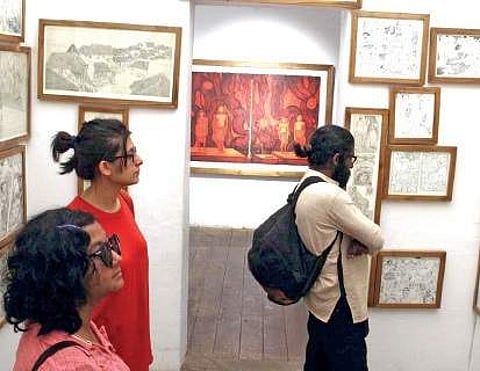 Visitors looking at the installation by Bara Bhaskaran at Aspinwall House in Fort Kochi Melton Antony