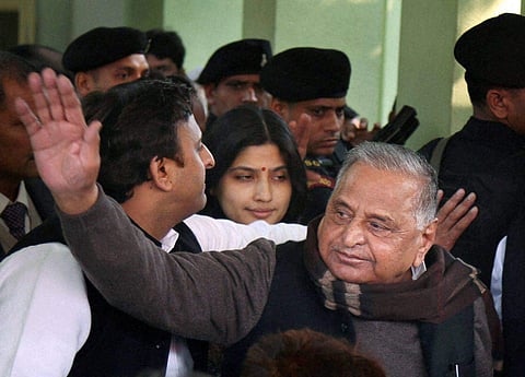 Uttar Pradesh Chief Minister and newly appointed party president Akhilesh Yadav with Mulayam Singh Yadav Dimple Yadav at party office in Lucknow on Sunday. | PTI