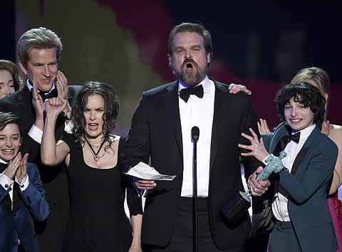 David Harbour and the cast of 'Stranger Things' accept the award for outstanding performance by an ensemble in a drama series at the 23rd annual Screen Actors Guild Awards. (Photo | AP)