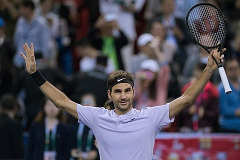 Supporters of Roger Federer of Switzerland celebrates winning his match during his men's semifinals singles match against Juan Martin Del Potro of Argentina at the Shanghai Masters tennis tournament in Shanghai .|AFP