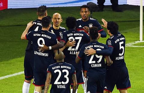 Bayern Munich's players celebrate after Corentin Tolisso's goal, during the German first division Bundesliga match against Hamburger SV. | AP