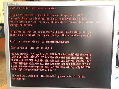 A message saying that the computer has been hit by ransomware is displayed on the monitor in an office somewhere in Moscow, Russia, Wednesday, Oct. 25, 2017. (Photo: AP)