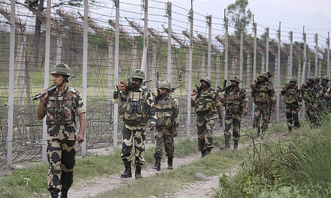 BSF personnel patrolling at the international border on the outskirts of Jammu. | (Photo | PTI)