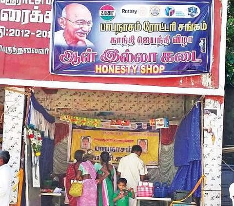 Customers at the Honesty Shop at Papanasam bus stop | Express