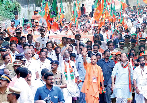 Uttar Pradesh Chief Minister Yogi Adityanath walks along with BJP state president Kummanam Rajasekharan in the Janaraksha Yathra on Wednesday from Keecheri to Kannur. BJP leaders V Muraleedharan, P K Krishnadas, national general secretary Arun Singh and