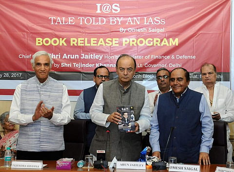 FM Arun Jaitley releasing a book entitled “I@S – TALE TOLD BY AN IASs” by a former IAS officer Omesh Saigal, in New Delhi. (Image courtesy Twitter @FinMinIndia)