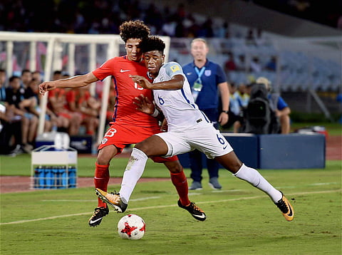 England White and Chile Red players vie for the ball during their FIFA U-17 World Cup football match in Kolkata on Sunday. (Photo | PTI)