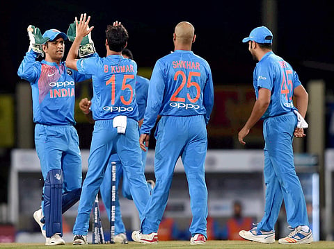 Indian bowler B.Kumar celebrates with his teammates after dismissing Australian batsman D.Warner during the 1st T20 cricket match between India and Australia in Ranchi on Saturday. | PTI