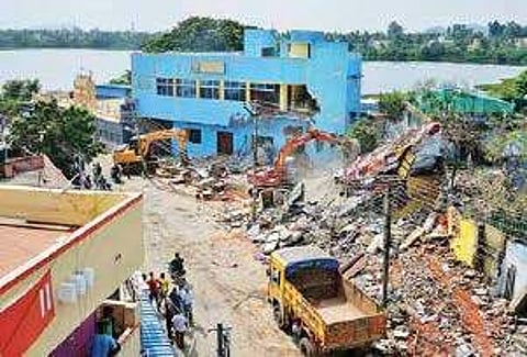 Demolition of commercial buildings on encroached land in progress at Chitlapakkam on Wednesday