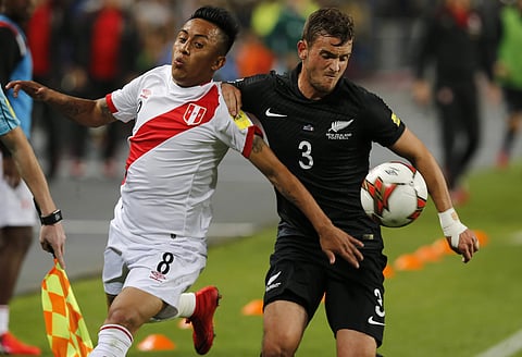Peru's Christian Cueva, left, fights for the ball with Peru's Aldo Corzo during a play-off qualifying match for the 2018 Russian World Cup in Lima. | AP