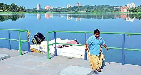A DTPC worker engaged in cleaning the landing strip at Aakkulam Boat Club B P Deepu