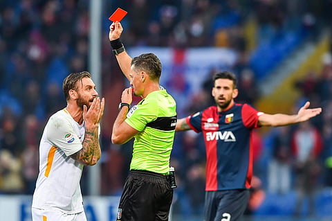 Referee shows Roma's Daniele De Ross a red card for slapping Lapadula |AP