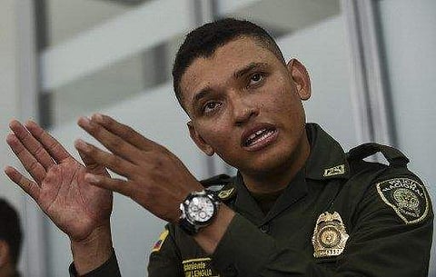 Colombian police second lieutenant Marlon Lengua takes part in an interview with AFP at the Metropolitan Police headquarters in Medellin, Colombia on November 25, 2017. | AFP
