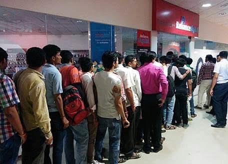 People waiting outside Reliance Digital Stores and Digital Xpress Mini Stores. (IANS)