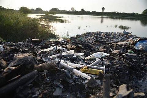 A lake in Bengaluru, polluted by the dumping the of medical waste