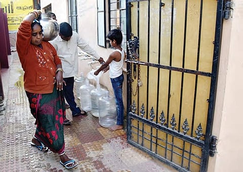 Villagers of Gaddapotharam in Sangareddy district collecting water from the water purifier | R Satish Babu