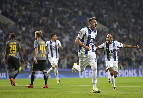 Porto's Hector Herrera, 2nd right, celebrates after scoring the opening goal during the Champions League group G soccer match between FC Porto and RB Leipzig at the Dragao stadium in Porto, Portugal, Wednesday, Nov. 1, 2017. | AP