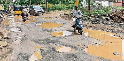 Potholes on the road at Manapakkam have become a danger for motorists | Martin Louis