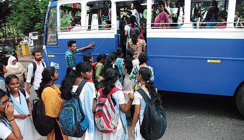 A group of students boarding a private bus in the city. Such crowds are visible in the city before and after school hours | K Shijith