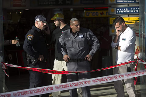 Israeli police officers stand guard at the scene of a stabbing attack in Jerusalem, Sunday, Dec. 10, 2017. | AP