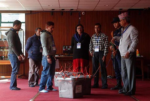 Nepalese election commission officials get ready to count votes in Kathmandu, Nepal, Friday, Dec. 8, 2017. (Associated Press)