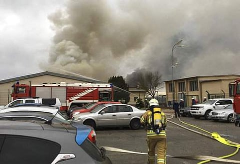 Photo provided by Red Cross section Gaenserndorf shows a firefighter in the gas station in Baumgarten an der March, Austria, near the Slovakian border, Tuesday, Dec. 12, 2017 after an explosion occurred. (AP)