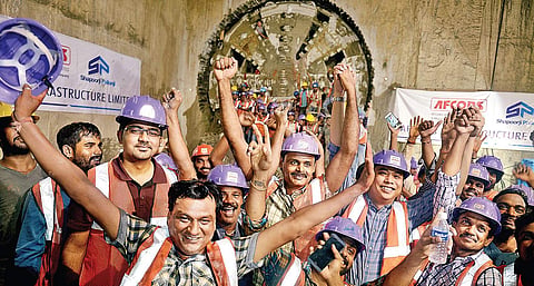 Workers rejoicing after completing the tunnelling of the final stretch from Government Estate to AG-DMS on Monday | D SAMPATH KUMAR