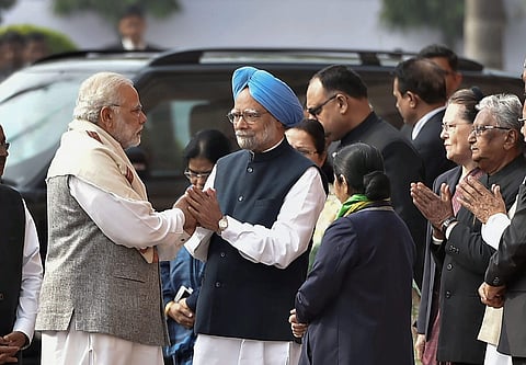 Prime Minister Narendra Modi and former prime minister Manmohan Singh exchange greetings during the tribute paying ceremony for the martyrs of 2001. (Photo | PTI)